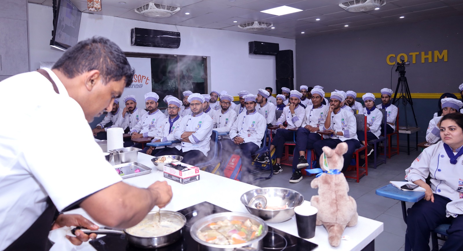 Executive Chef Mohammad Raees with COTHM students in culinary session