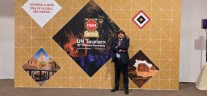 Delegates discussing global hospitality education and sustainability at UN Tourism.