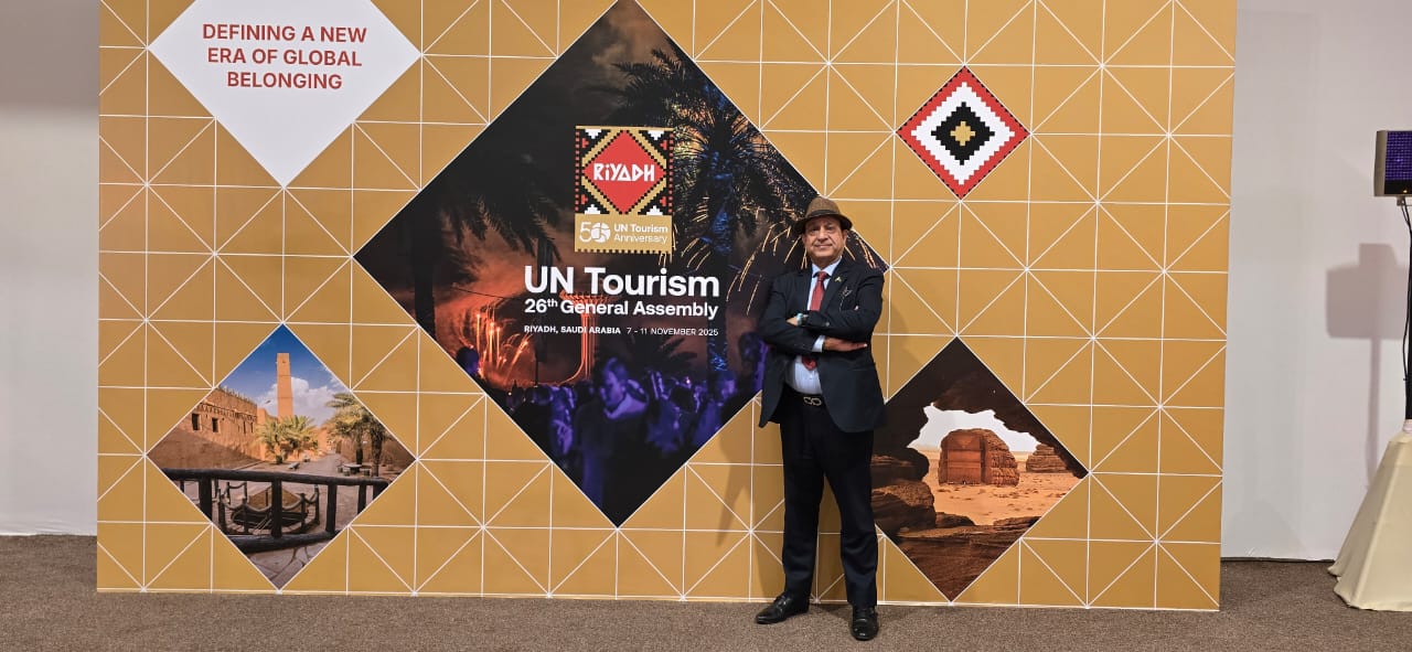 Delegates discussing global hospitality education and sustainability at UN Tourism.