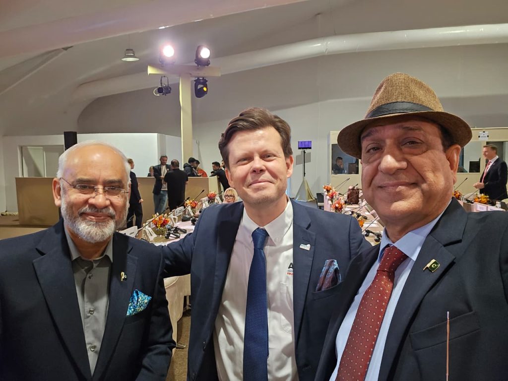 International tourism leaders collaborating at the UN Tourism General Assembly.